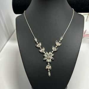 Silver tone necklace with rhinestone stones